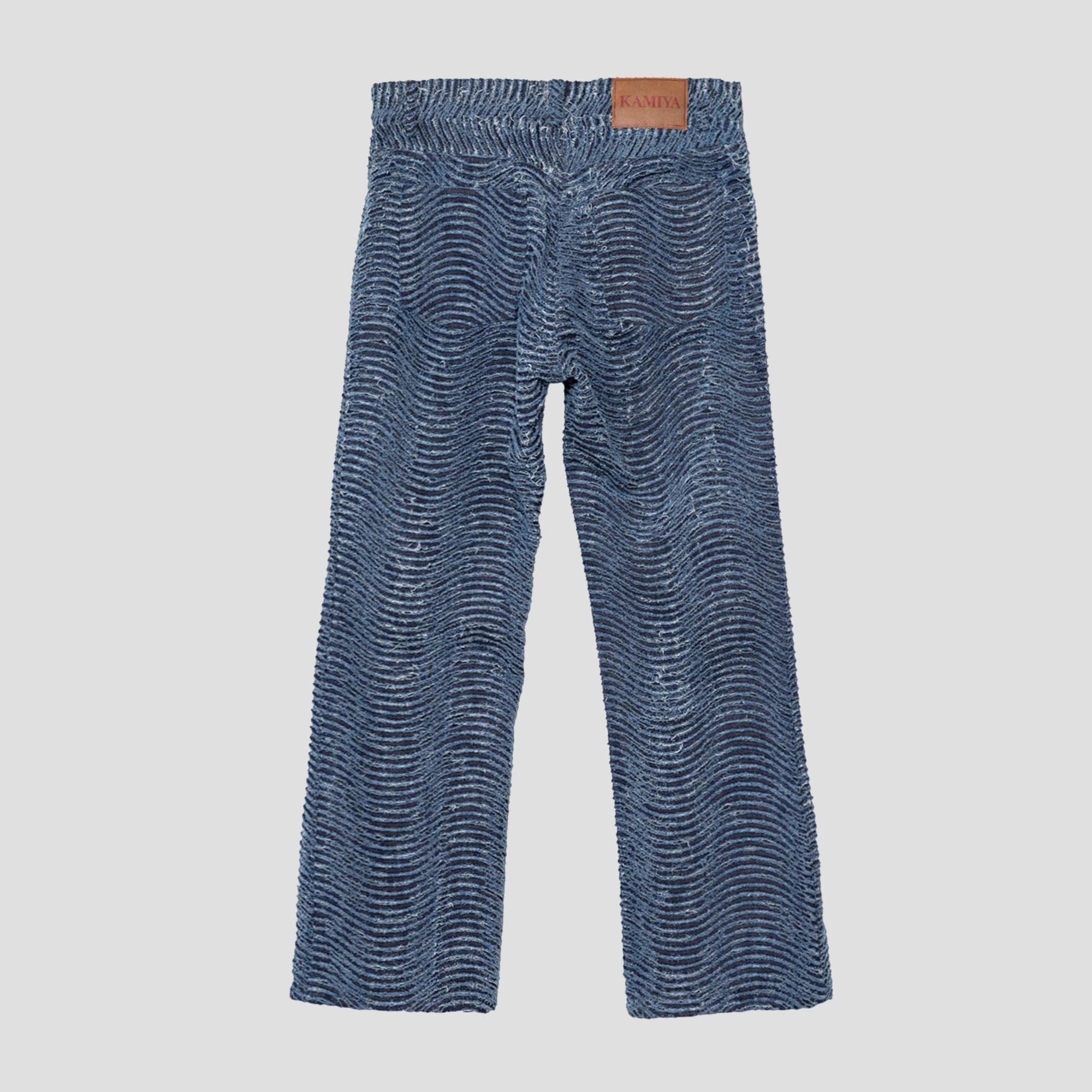 DISTRESSED WAVY DENIM PANTS