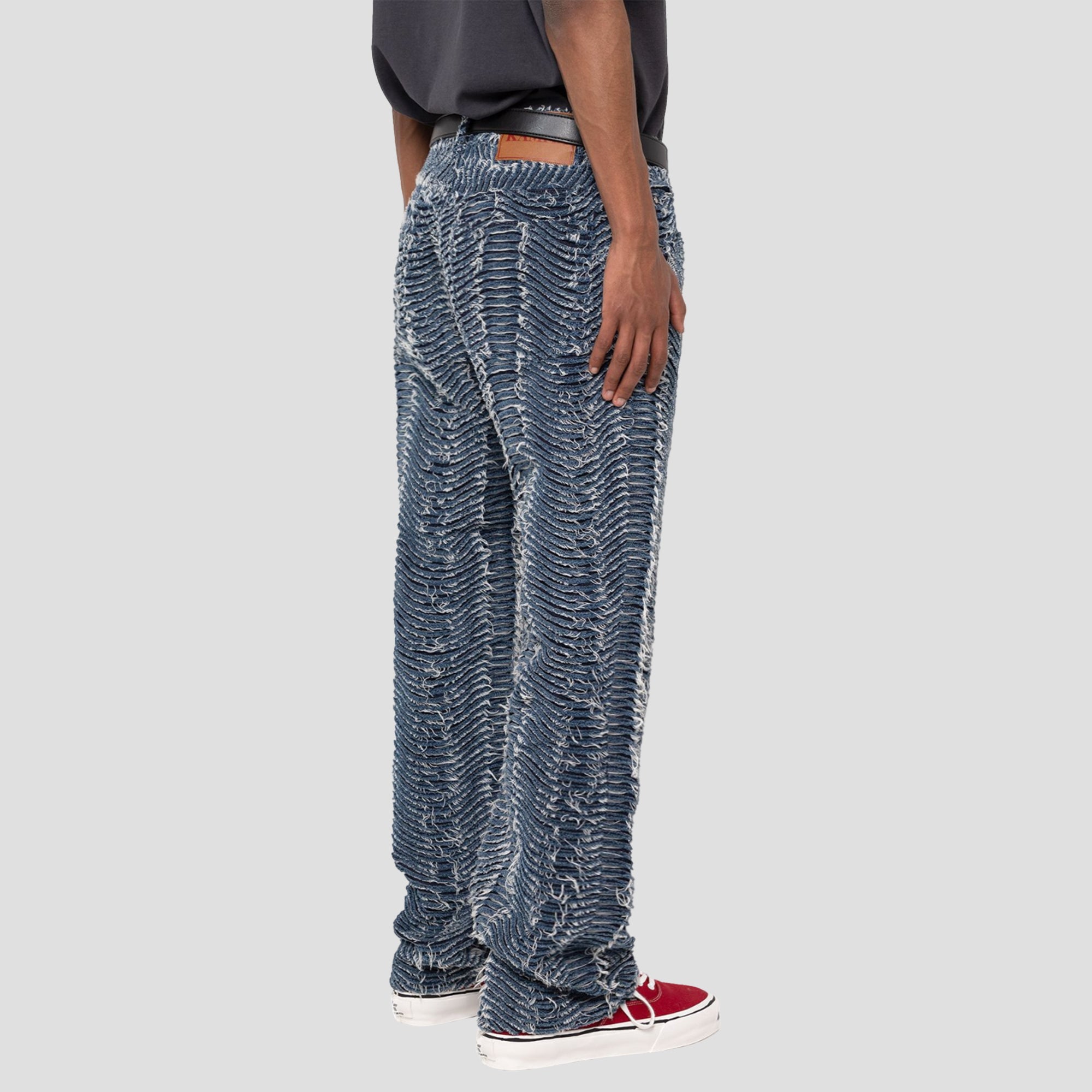 DISTRESSED WAVY DENIM PANTS