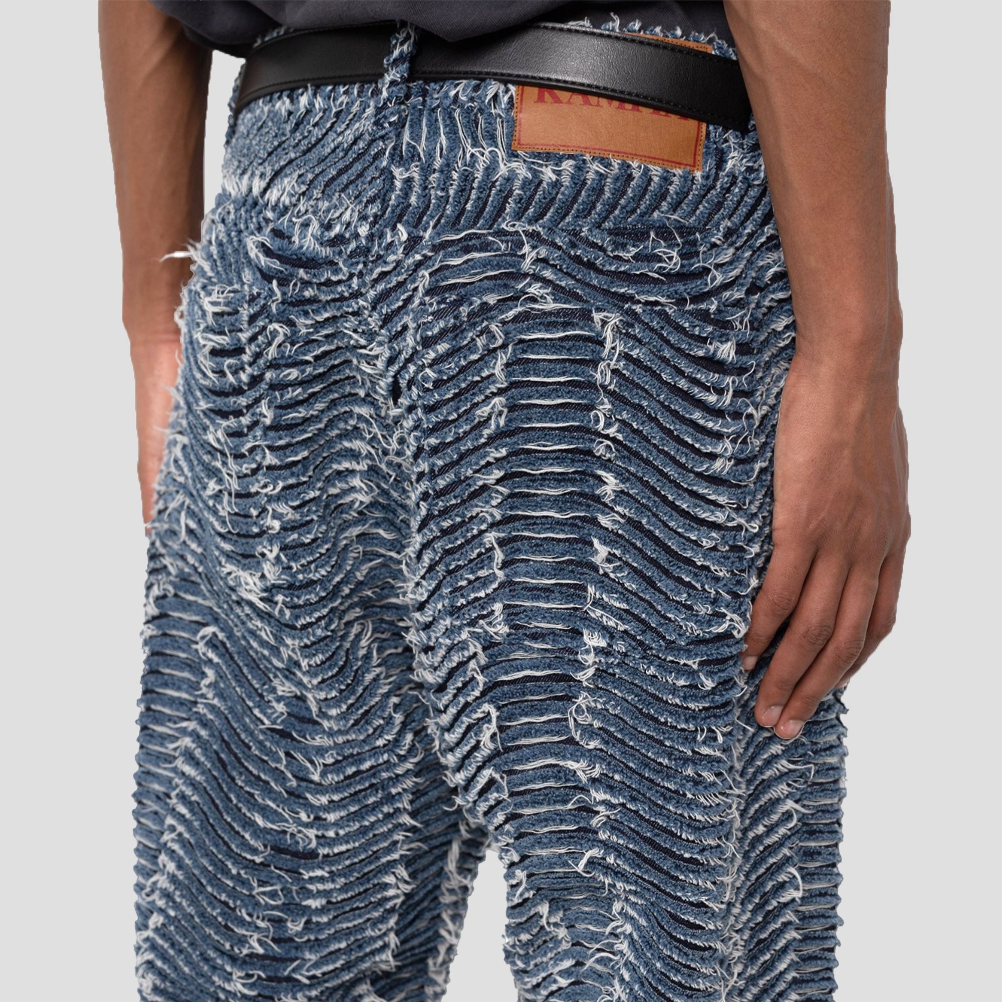 DISTRESSED WAVY DENIM PANTS