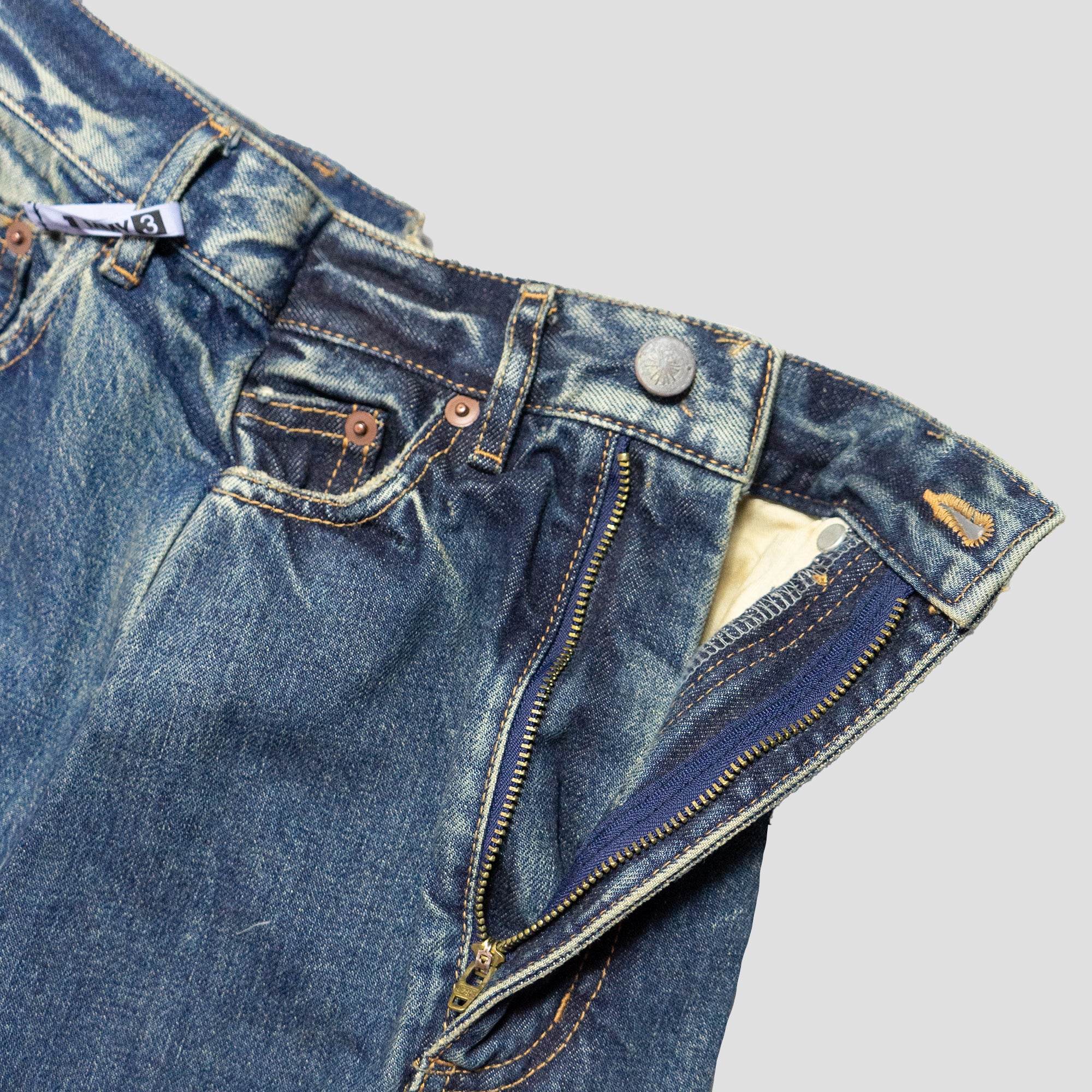 DECONSTRUCTED DENIM JEANS