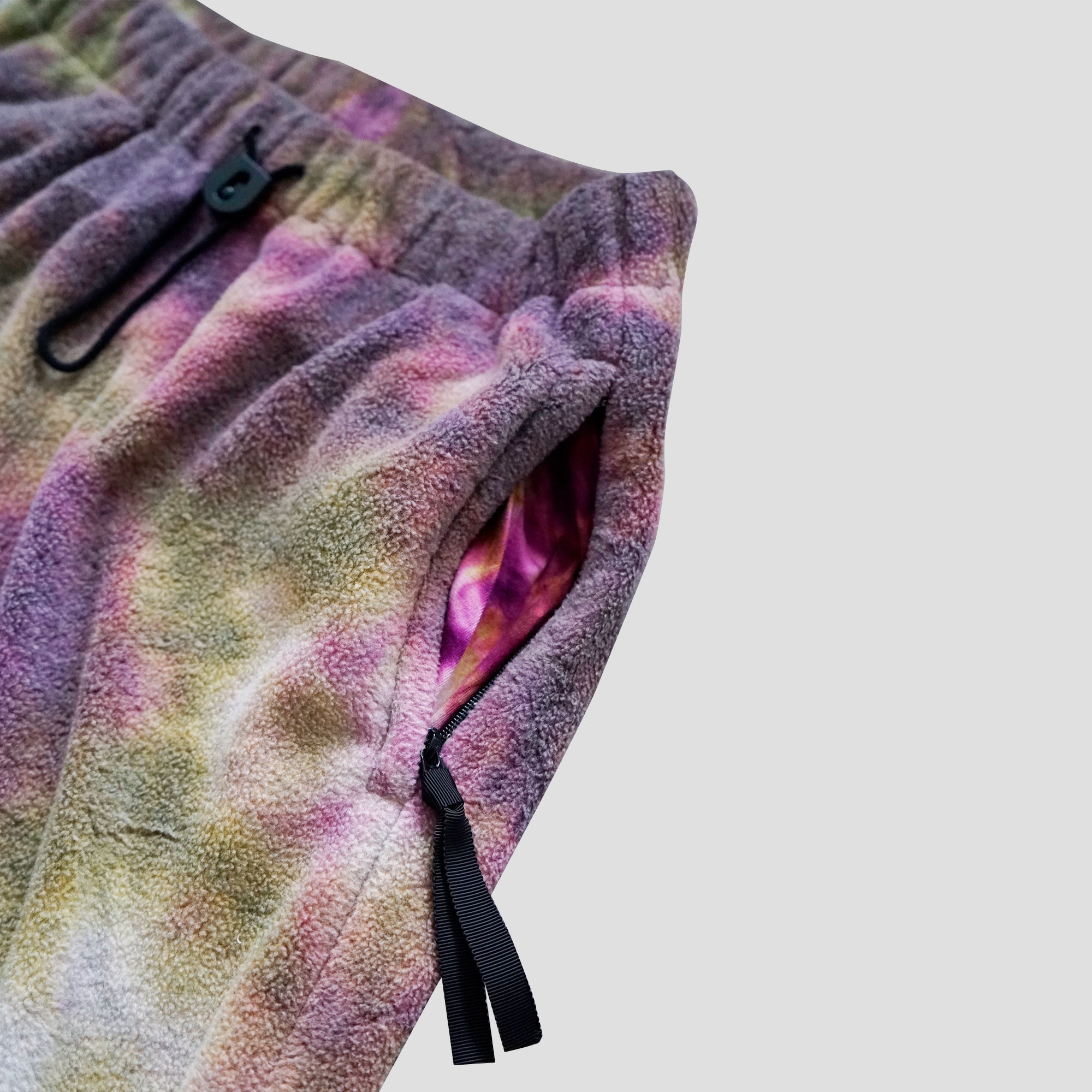 REVERSIBLE FLEECE TIE DYE FLARE PANTS - PURPLE/OLIVE