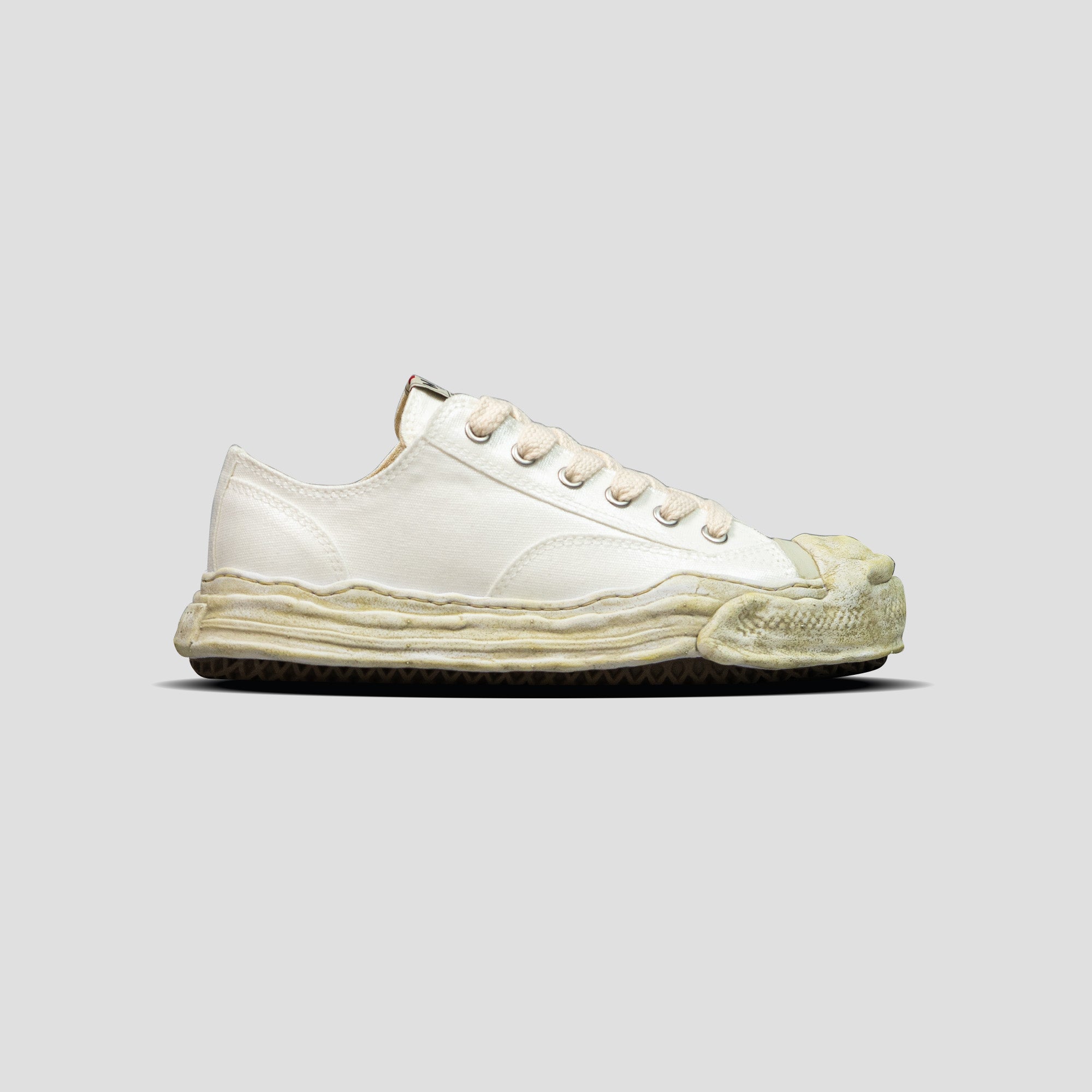 HANK OG SOLE LOW-TOP LAMINATED CANVAS SNEAKERS